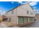 Exterior view of townhome with garages and a well-maintained facade at 7700 W Glasgow Pl # C, Littleton, CO 80128