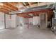 Spacious unfinished basement area featuring exposed ceiling and a small window for natural light at 2629 Wisteria Dr, Erie, CO 80516