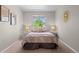 Serene bedroom with a plush bed, soft lighting, and neutral tones, creating a relaxing and inviting atmosphere at 2629 Wisteria Dr, Erie, CO 80516