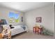 Bright bedroom with a playful decor, offering a comfortable space for rest and relaxation with ample natural light at 2629 Wisteria Dr, Erie, CO 80516