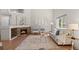 Inviting living room with a stone fireplace, plush seating, and plenty of natural light at 2629 Wisteria Dr, Erie, CO 80516