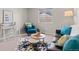 Comfortable living area featuring stylish furniture, bright natural light, and a cozy, inviting atmosphere at 2629 Wisteria Dr, Erie, CO 80516