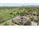 Aerial view of neighborhood with golf course and city skyline at 2945 E 26Th Avenue Pkwy, Denver, CO 80205
