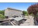 Backyard patio features a fire pit, outdoor seating, and well-maintained landscaping at 2945 E 26Th Avenue Pkwy, Denver, CO 80205