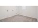 Bedroom with soft carpeting, closet storage, and ample natural light at 2945 E 26Th Avenue Pkwy, Denver, CO 80205