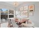 Bright dining area featuring a wooden table, stylish chairs, and curated gallery wall at 2945 E 26Th Avenue Pkwy, Denver, CO 80205