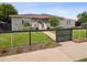 Charming brick home with well-manicured lawn and fenced yard at 2945 E 26Th Avenue Pkwy, Denver, CO 80205