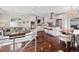 Bright, open-concept kitchen with stainless steel appliances, island, and hardwood floors flows to living area at 2945 E 26Th Avenue Pkwy, Denver, CO 80205