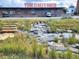View of York Street Yards with green space and flowing stream at 2945 E 26Th Avenue Pkwy, Denver, CO 80205