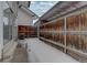 Long, narrow backyard with wooden fence and snow on the ground at 6495 E Happy Canyon Rd # 88, Denver, CO 80237