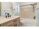 Updated bathroom with a bathtub, modern vanity, and marble floors at 8362 White Cloud St, Highlands Ranch, CO 80126