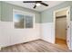 Bedroom with light walls, ceiling fan, and walk-in closet at 8362 White Cloud St, Highlands Ranch, CO 80126