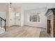 Bright entryway with hardwood floors and a view into the living room at 8362 White Cloud St, Highlands Ranch, CO 80126