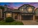 Two-story house with a dark brown garage door and landscaped yard at 8362 White Cloud St, Highlands Ranch, CO 80126