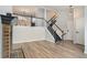 Living room with fireplace, staircase, and hardwood floors at 8362 White Cloud St, Highlands Ranch, CO 80126