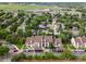 Stunning aerial view of a condo complex with mature trees, green space, and community amenities at 7379 S Gore Range Rd # 304, Littleton, CO 80127