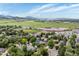 Beautiful aerial view of the neighborhood with mountains and open green spaces on a bright, sunny day at 7379 S Gore Range Rd # 304, Littleton, CO 80127