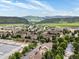 Aerial view of a community nestled among rolling hills and lush greenery at 7379 S Gore Range Rd # 304, Littleton, CO 80127
