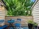 Outdoor balcony with blue seating, a small table, and string lights for relaxing at 7379 S Gore Range Rd # 304, Littleton, CO 80127