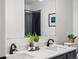 Modern bathroom featuring double sinks, quartz counters, and stylish fixtures at 7379 S Gore Range Rd # 304, Littleton, CO 80127