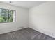 Clean and bright bedroom with neutral walls, carpet, and ample natural light at 7379 S Gore Range Rd # 304, Littleton, CO 80127