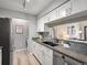 Modern kitchen showcasing granite countertops, stainless steel appliances, and bright cabinetry at 7379 S Gore Range Rd # 304, Littleton, CO 80127