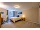 Bright bedroom with a bed, a window with blinds, and a dedicated workspace with desk and chair at 428 W Valleyview Ave, Littleton, CO 80120