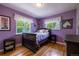 Cozy bedroom with colorful decor, hardwood floors, and plenty of natural light at 428 W Valleyview Ave, Littleton, CO 80120