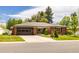 Charming brick home with a well-manicured lawn, mature landscaping and a spacious two car garage at 428 W Valleyview Ave, Littleton, CO 80120