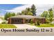 Charming red brick ranch-style home with a well-manicured front lawn and attached two-car garage at 428 W Valleyview Ave, Littleton, CO 80120