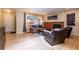 Cozy living room featuring hardwood floors, a brick fireplace, and natural light at 428 W Valleyview Ave, Littleton, CO 80120