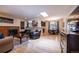 Inviting living room with a brick fireplace, hardwood floors, and a dining area at 428 W Valleyview Ave, Littleton, CO 80120