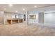 Spacious finished basement featuring a wet bar and mirrored walls at 6150 S Fulton St, Englewood, CO 80111