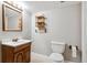 Basement bathroom with wood vanity and neutral color scheme at 6150 S Fulton St, Englewood, CO 80111