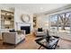 Living room with fireplace and built-in shelving at 6150 S Fulton St, Englewood, CO 80111