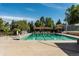 Inviting community pool with a covered patio and lounge chairs at 6150 S Fulton St, Englewood, CO 80111