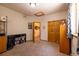 Cozy bedroom features neutral walls, carpet, closet, and a large window at 6752 S Columbine Rd, Evergreen, CO 80439