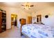 Bedroom with ensuite bathroom featuring a door and soft carpet. A cozy and inviting space at 6752 S Columbine Rd, Evergreen, CO 80439