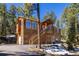 Exterior elevation of the home featuring a staircase at 6752 S Columbine Rd, Evergreen, CO 80439