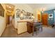 Hallway featuring a piano, wood floors, and wall decor at 6752 S Columbine Rd, Evergreen, CO 80439