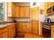 Kitchen showcasing wood cabinets, stainless appliances, and hardwood floors at 6752 S Columbine Rd, Evergreen, CO 80439