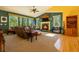 Inviting living room features a cozy fireplace, plush seating, and large windows with scenic outdoor views at 6752 S Columbine Rd, Evergreen, CO 80439