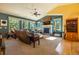 Living room with a fireplace, large windows, and comfortable seating at 6752 S Columbine Rd, Evergreen, CO 80439