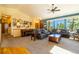 Bright living room featuring dual sofas, a ceiling fan and a piano at 6752 S Columbine Rd, Evergreen, CO 80439