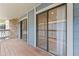 Balcony featuring sliding glass doors and a stone facade at 8600 E Alameda Ave # 22-208, Denver, CO 80247