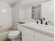 Bathroom with white cabinets, bathtub, and vanity with modern fixtures and lots of light at 8600 E Alameda Ave # 22-208, Denver, CO 80247