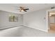 Neutral bedroom with a ceiling fan and a window for natural light at 8600 E Alameda Ave # 22-208, Denver, CO 80247