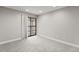 Carpeted room showcasing neutral walls, recessed lighting and sliding door access to the outside at 8600 E Alameda Ave # 22-208, Denver, CO 80247