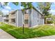 Exterior view of multi-level condo building with balcony and stone veneer at 8600 E Alameda Ave # 22-208, Denver, CO 80247