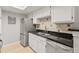 Kitchen featuring stainless steel appliances, granite countertops, and bright white cabinets at 8600 E Alameda Ave # 22-208, Denver, CO 80247